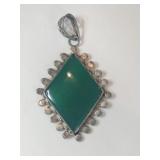 Silver greenstone pendant marked 925.    .320oz