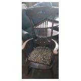 Ornate wooden armed rocking chair
