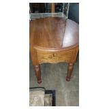 Oval top side table with drawer