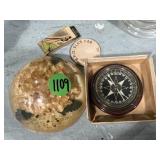 Compass, resin paperweight, old wooden nickel and