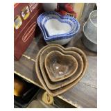 Two sets of three nesting heart bowls