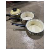 Three small sauce pans, one with lid