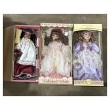 3 porcelain dolls with boxes