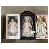 3 porcelain dolls with boxes one in display case