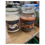 Two 18 oz jar candles one Tahitian coconut colada