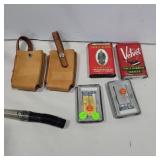 Tobacco tins, lighters, leather magazine cases