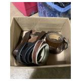 Box full of various leather belts