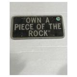 "Own a piece of the rock" sign