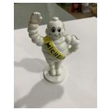 Modern cast-iron Michelin man coin bank