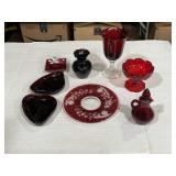 Various red glass dishes and purple ruffled glass