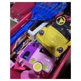 Tote of a variety of toys, including remote,