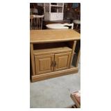 Small Tv entertainment center has damage