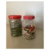 Jar of marbles and jar of various beads