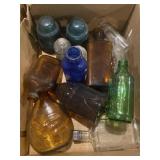 Collection of old bottles and glass insulators