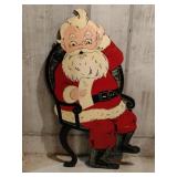 Wooden Santa in a chair display 50 in tall