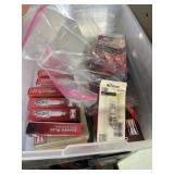 Mostly Champion spark plugs in plastic carrier