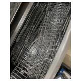 Tote full of stainless pegboard wire shelving