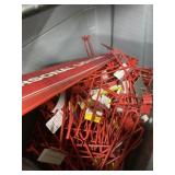 Tote full of red, pegboard, hangers, and personal