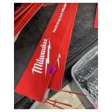 Three used Milwaukee pegboard signs