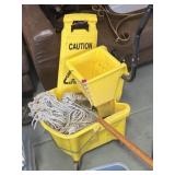 Mop, bucket, caution wet floor sign