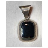 Silver native American black onyx pendant marked