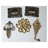 Silver and gold tone brooches