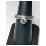 Silver light blue band ring marked 925.  "ND"