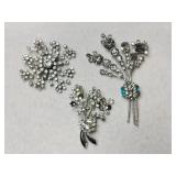 3 silvertone clear rhinestone brooches
