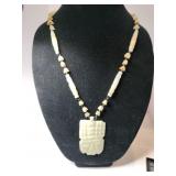 Hand carved white onyx figural pendant necklace
