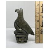Carved stone bird figure