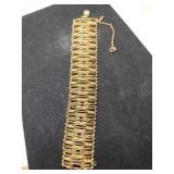 Monet gold tone linked bracelet with safety chain