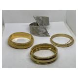 Gold and silver tone textured hinged bangle