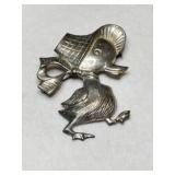 Silverman Brothers duck in a bonnet pin.   Marked