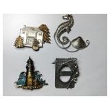 Gold and silver tone brooches