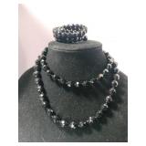 Two black beaded necklaces and bracelet