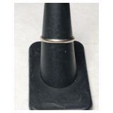 White gold band ring  marked 14k.  (TW).  Size 7.