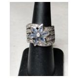Silver flowered band ring marked 925 size 6.