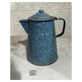 blue and white speckled enamelware coffee pot