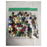 Bag of assorted glass marbles.