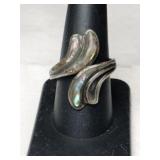 silver wrap around ring marked Mexico 925. Signed