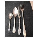 Silver forks and spoon marked Sterling.    1.705