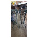 Wrought iron stands with twisted iron legs one