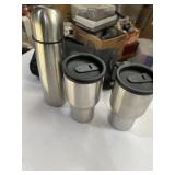 Stainless steel thermos with two mugs and