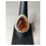 Silver large orangish Stone marked 925 size 8