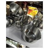 Stainless steel pots, pans, and measuring pot