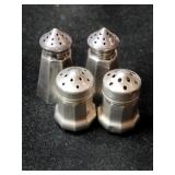 Silver salt and pepper shakers marked Sterling.