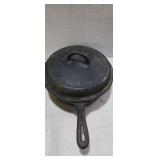 Deep side cast iron frying pan with lid marked