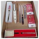 Letter openers, sewing scissors, and bottle