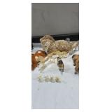 Horse figurines, one made of small sea shells ,