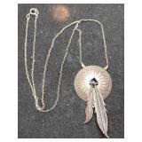 Silver native American round feathered pendant